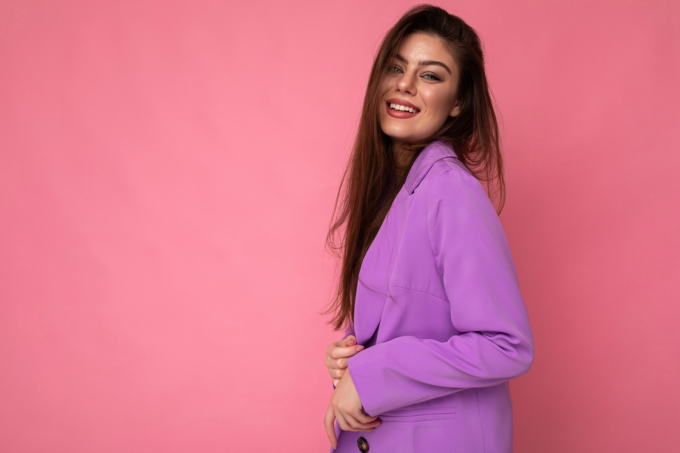 Side-Profile Photo of Positive Young Business Woman Wearing Purple Suit Isolated on Background. Copy Space